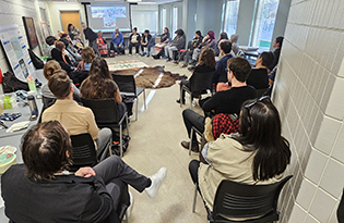 group sitting in a circle in a classroom